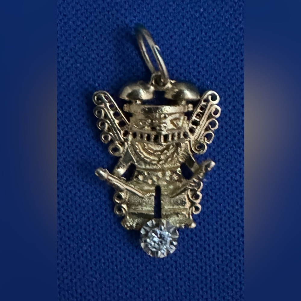 14K yellow gold pendant with small diamond.
